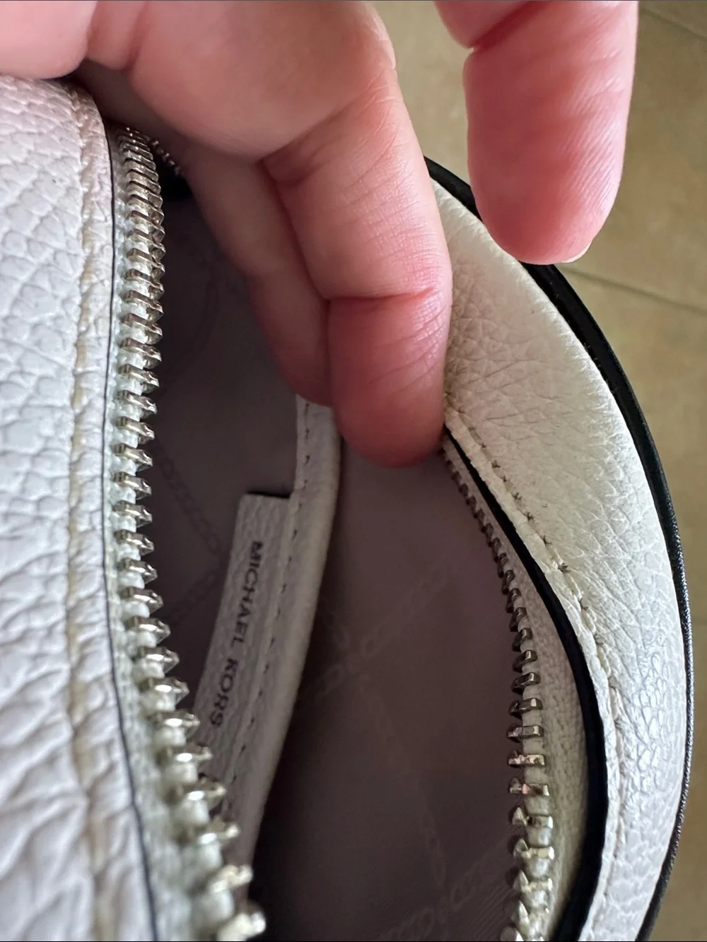 Michael Kors White Round Crossbody with Black Stripes and Branded Strap